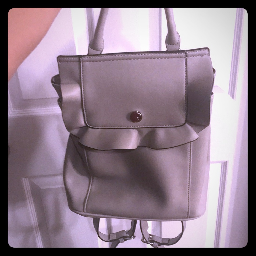 Grey imitation leather back pack/ purse